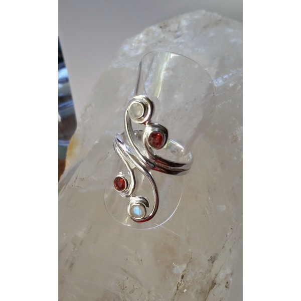 Spirals of sterling silver set with 4 faceted gemstones