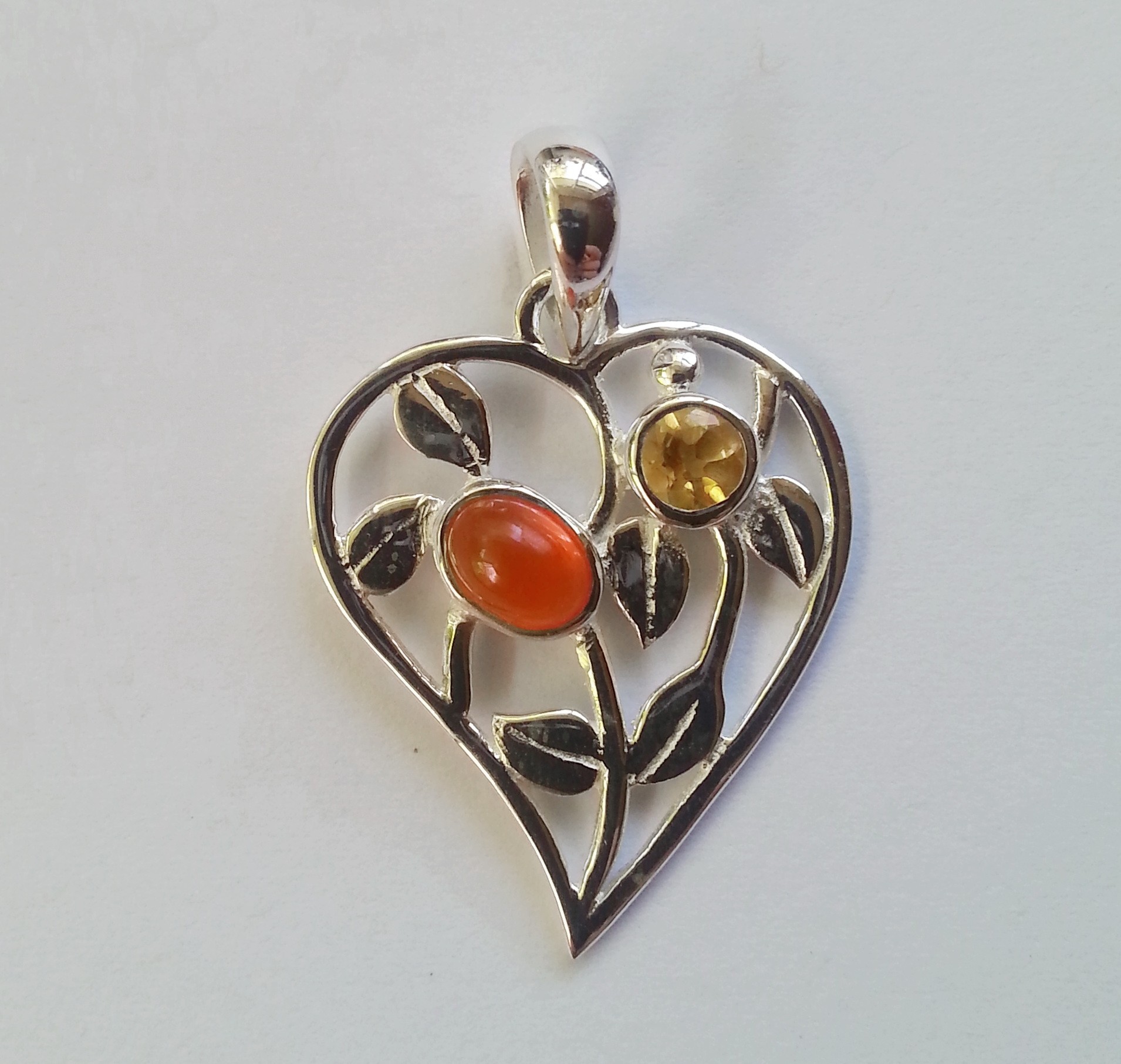 Heart shaped with 2 natural gemstones set in sterling silver