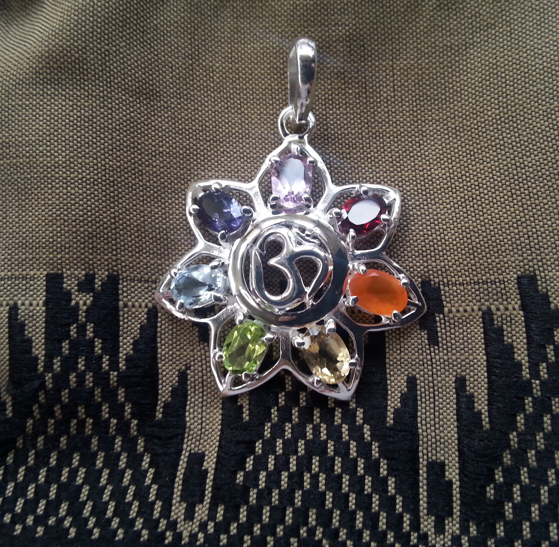 flower with om and chakra gemstones pendant