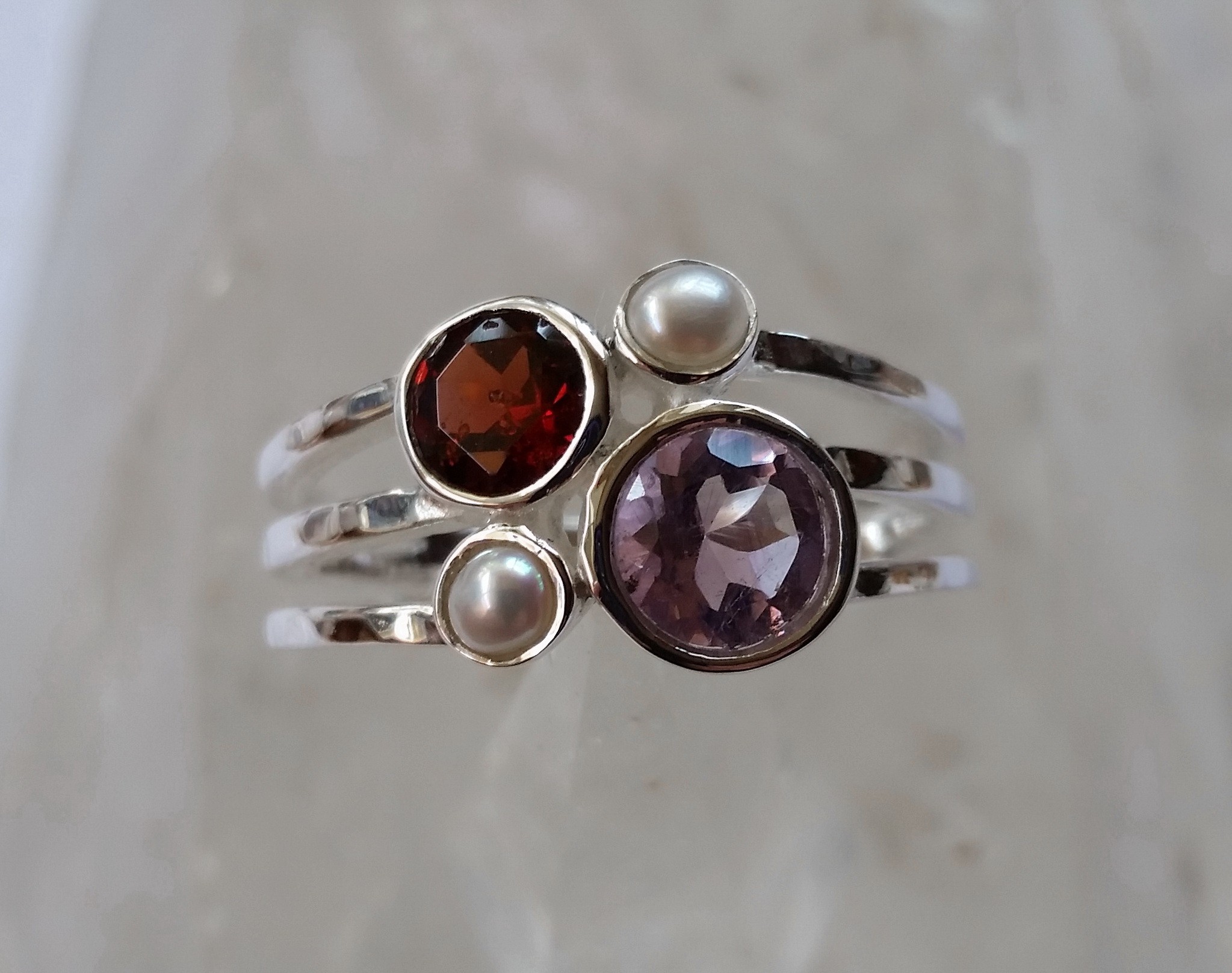 All genuine gems set into 925 sterling silver ring.